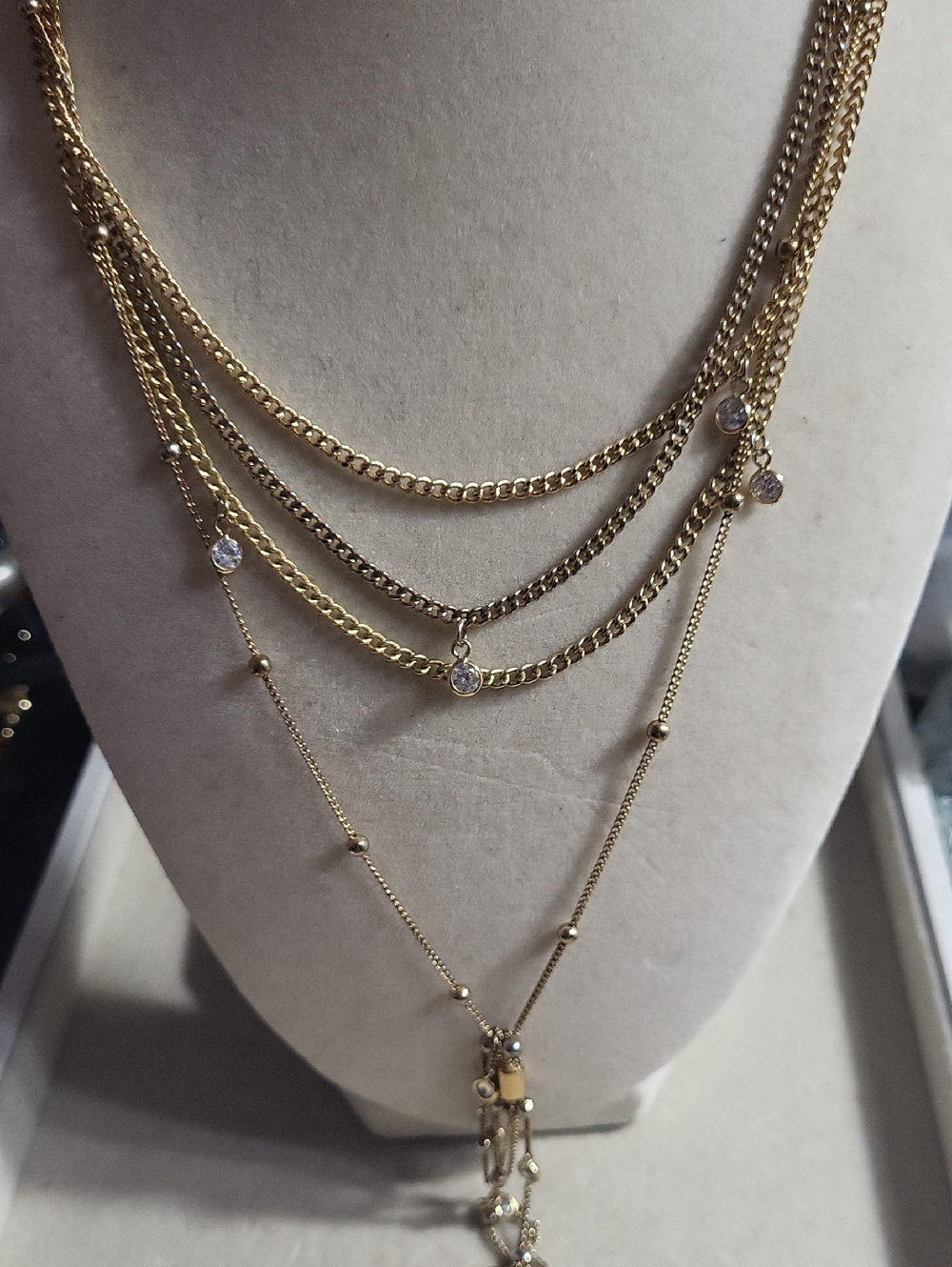 Ellika Gold Tone  Layered Multi-Chain Necklace with Crystal Accents